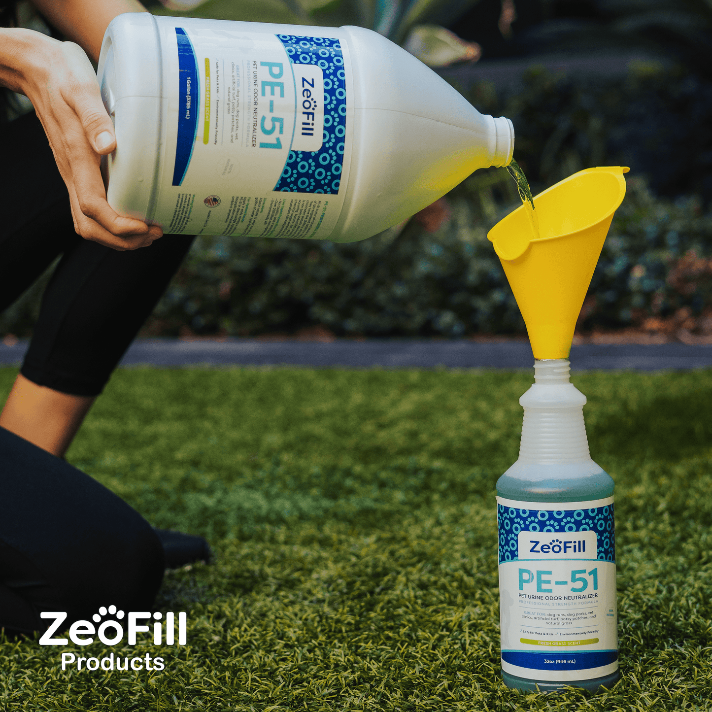 Image of PE-51 Gallon refilling 32oz bottle with funnel